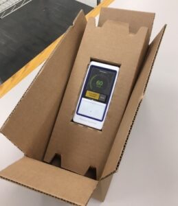 A box that has an iphone inside of it.