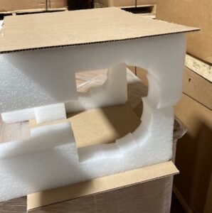 A cardboard box with some type of object inside