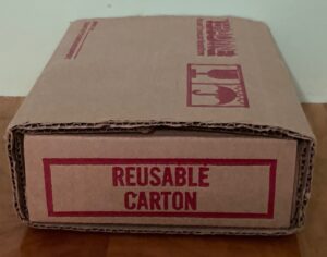 A box that has the words " reusable carton ".