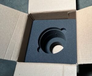 A box with a black and white object inside of it